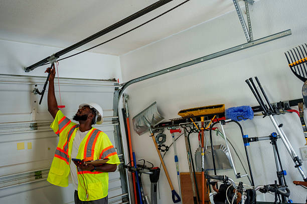 Professional Garage Door Panel Replacement technician working in Hoisington, KS